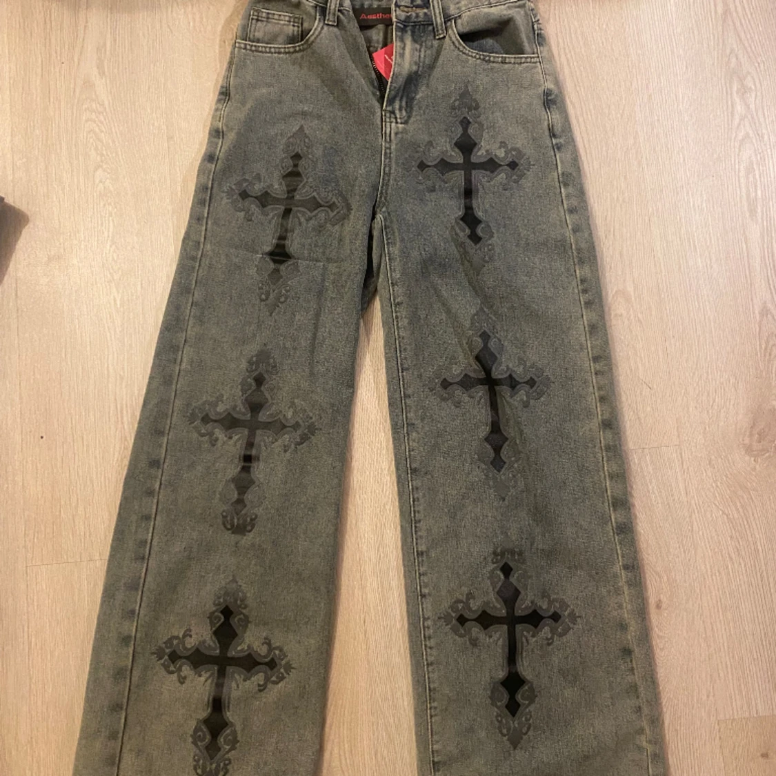 Light gray cross jeans