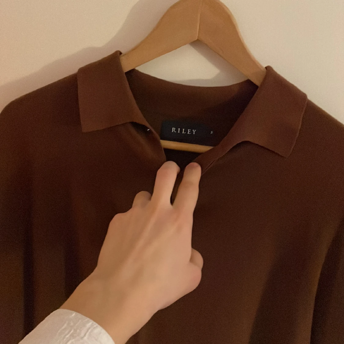 Lånärmad stickad piké. - 91