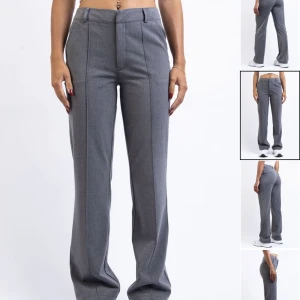 Grå kostymbyxor  - Säljer dessa kostymbyxor från madlady, modellen är ”Mid Waist Kostymbyxor Med Stråveck - Gina Mid Grey”. I storlek 38-tall. De är helt oanvända💕