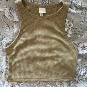 Linne - Linne i guldglittrig färg från HM storlek M Aldrig använt 