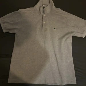 Lacoste piké  - Strl M men passar även S