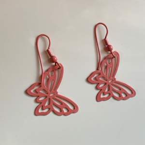 Pink butterfly earrings. 
