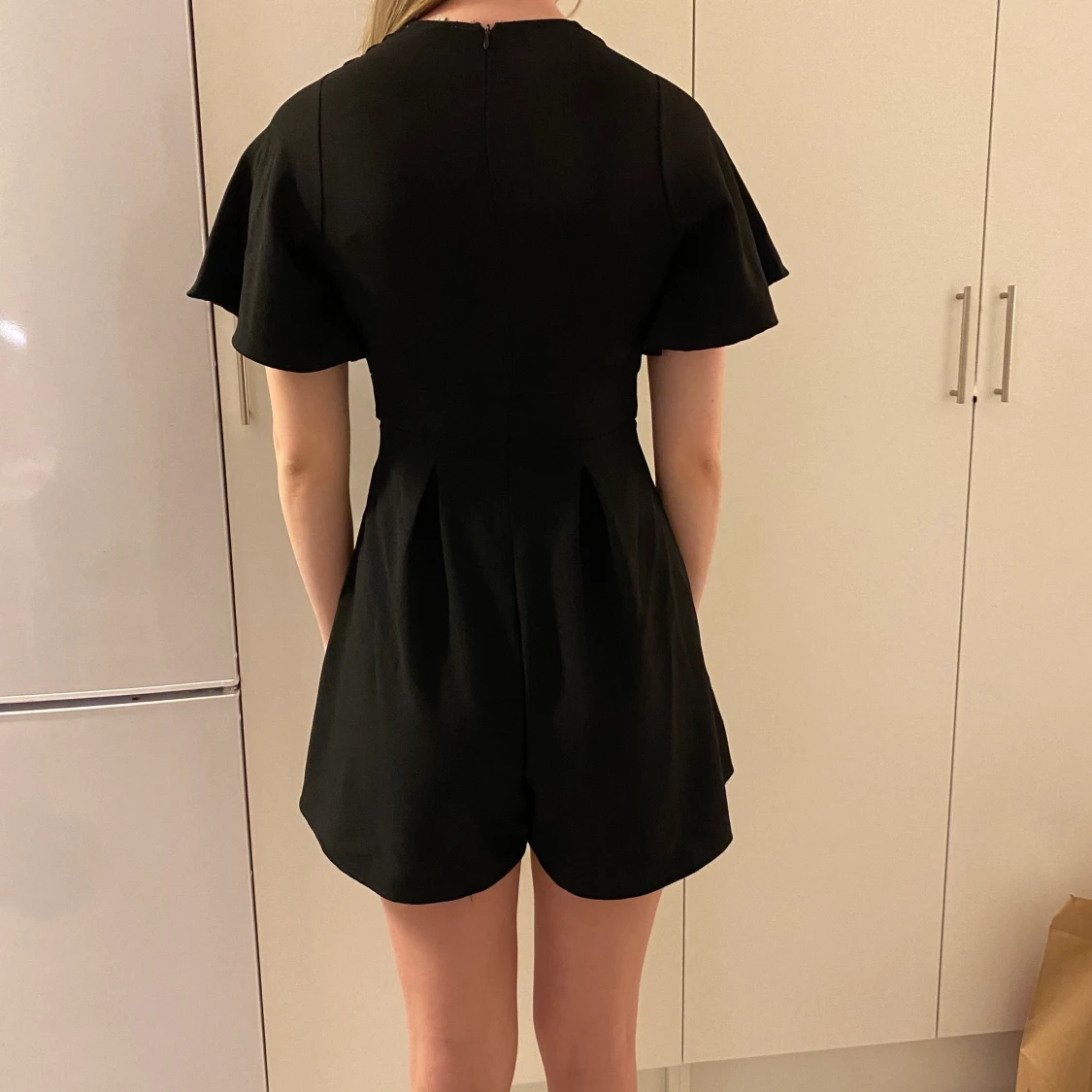 Svart playsuit  - 90