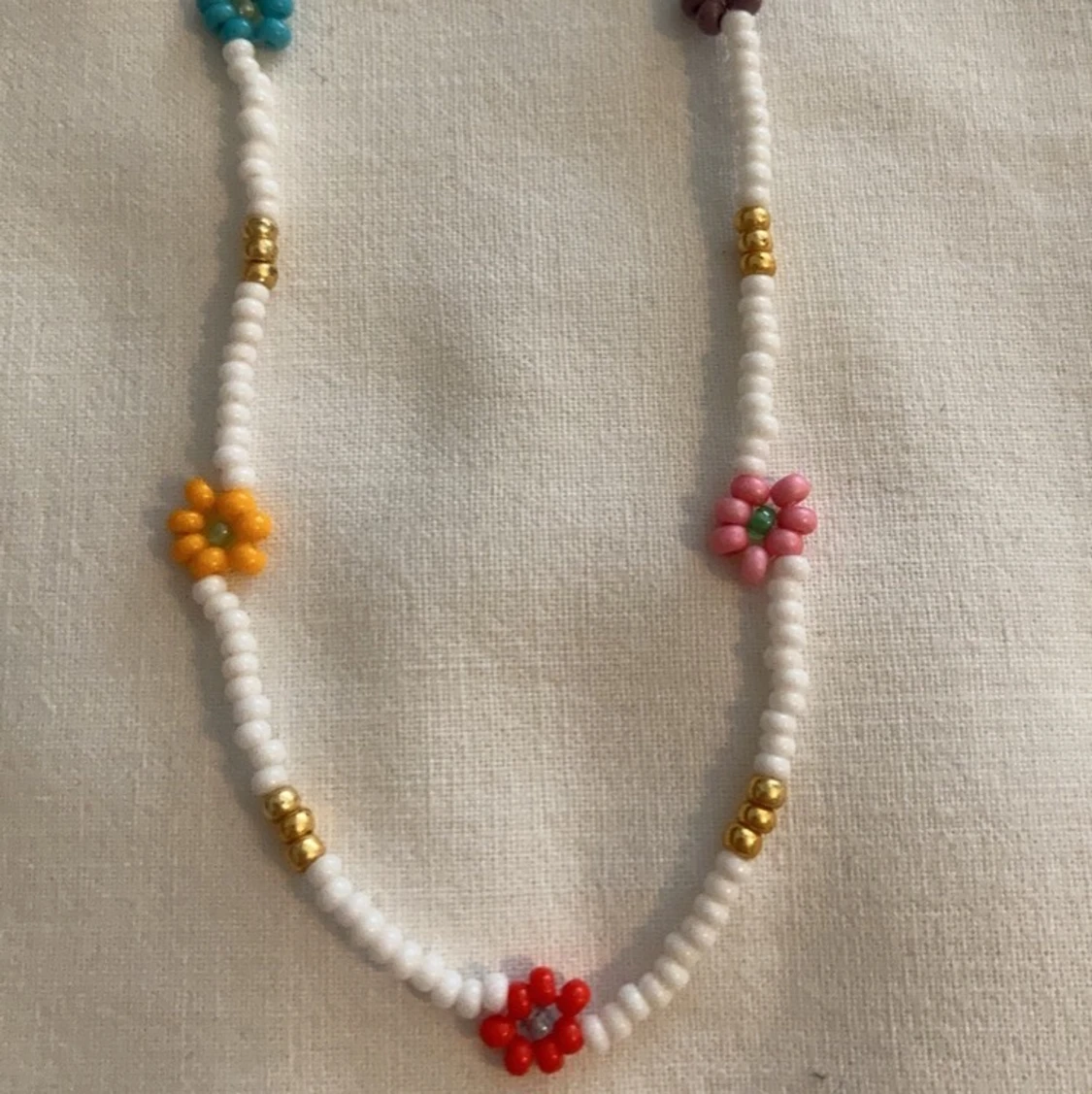 Halsband blommor - 90