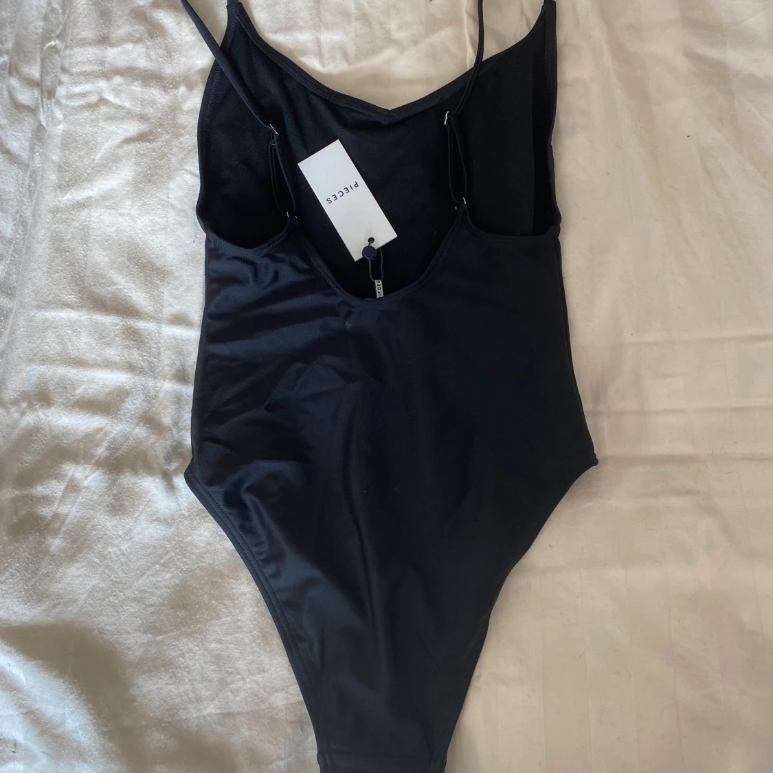 Oanvänd baddräkt stl XS - 90