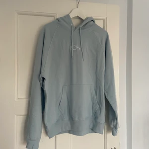 Ljusblå Hoodie unisex - Storlek medium helt ny