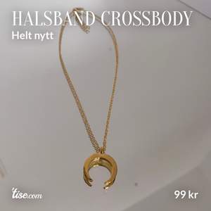 Oanvänt halsband i guldfärg från crossbody.dk. Ej äkta guld. Längd på kedja: 42 cm. Storlek på berlock: 1,5 cm. Skriv vid frågor :)