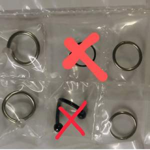 Unused piercings in the original packaging. Tunnel is 20mm. The plain silver rings have hinges and are 1.2x12mm. All the twisters are 1.6x10mm.  Price is 10kr each.