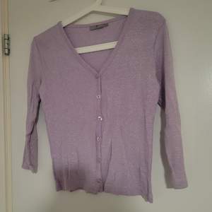 The cardigan  is used, but it has no flaws. Cute shimmering cardigan.