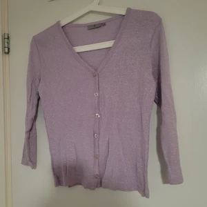 shimmering lavender cardigan - The cardigan  is used, but it has no flaws. Cute shimmering cardigan.