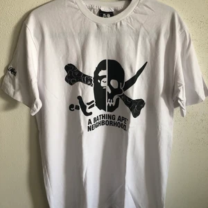 Bape x Neighborhood Collab Tee - Bape / A Bathing Ape x Neighborhood / NBHD Collab T-Shirt  Size medium, fits like a men’s regular medium.  Great condition, no flaws or damage.  DM if you need exact size measurements.   Buyer pays for all shipping costs. All items sent with tracking number.   No swaps, no trades, no offers.  