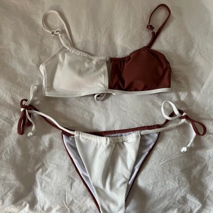 Helt ny vit/brun bikini strl M - Helt ny vit/brun bikini i storlek M, passar även S. Uttagbara pads och justerbara band. Skyddet kvar! Frakt 52kr🥰