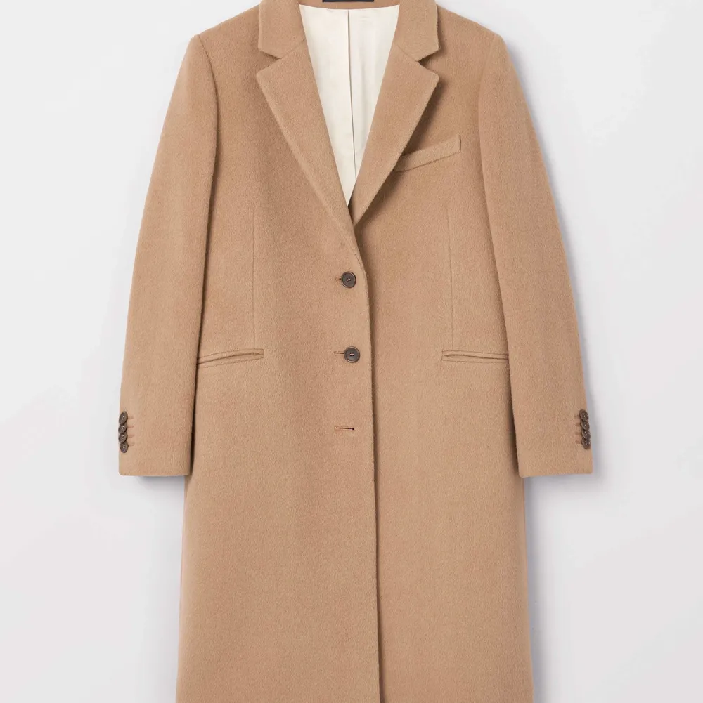 Beige wool coat from Tiger of Sweden. Have only used once and selling it because it is a little big for me. Size 36. Jackor.