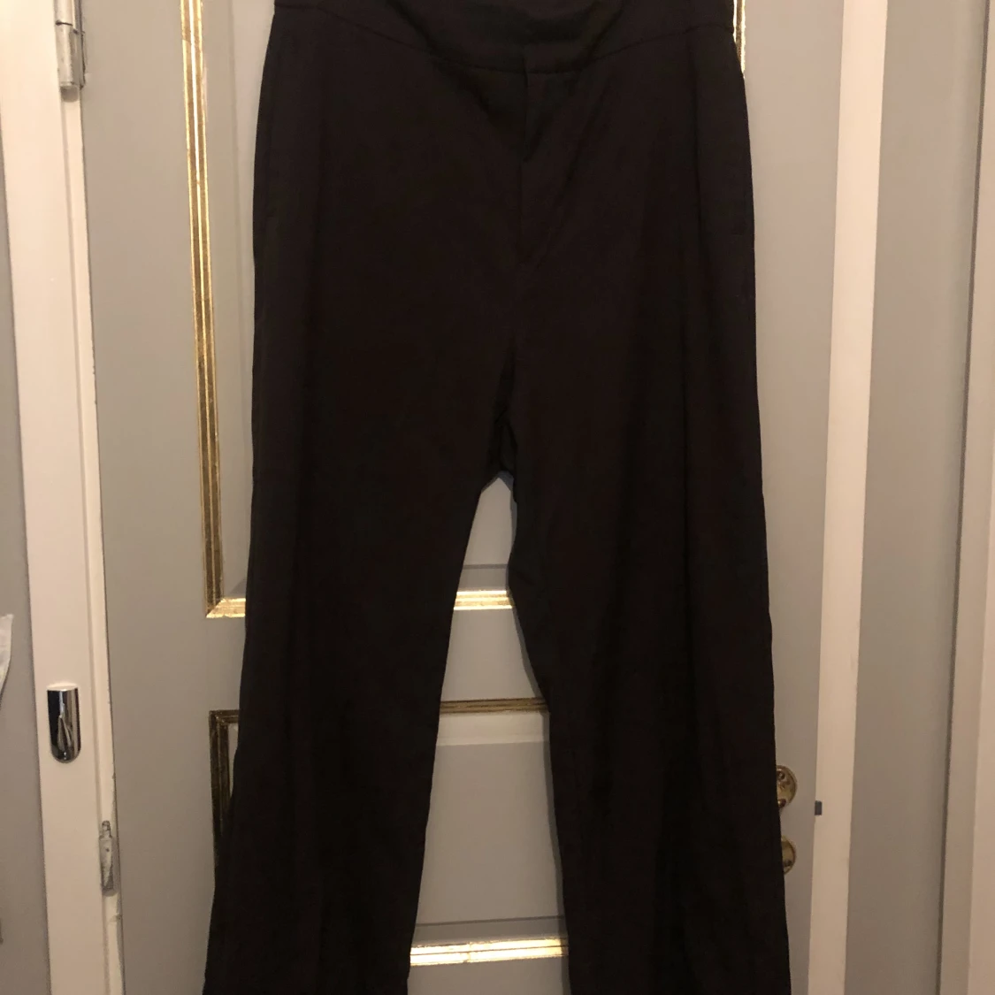 Bruna kostymbyxor storlek 46