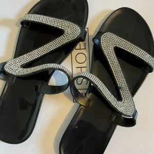 Tofflor - Storlek 39