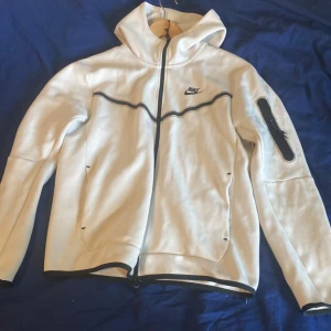 White Nike tech  - Used but good condition, zippers a little roughed up