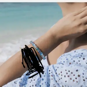 Blått Caroline svedjorna armband som är uttöjbart, skriv för bilder på armbandet