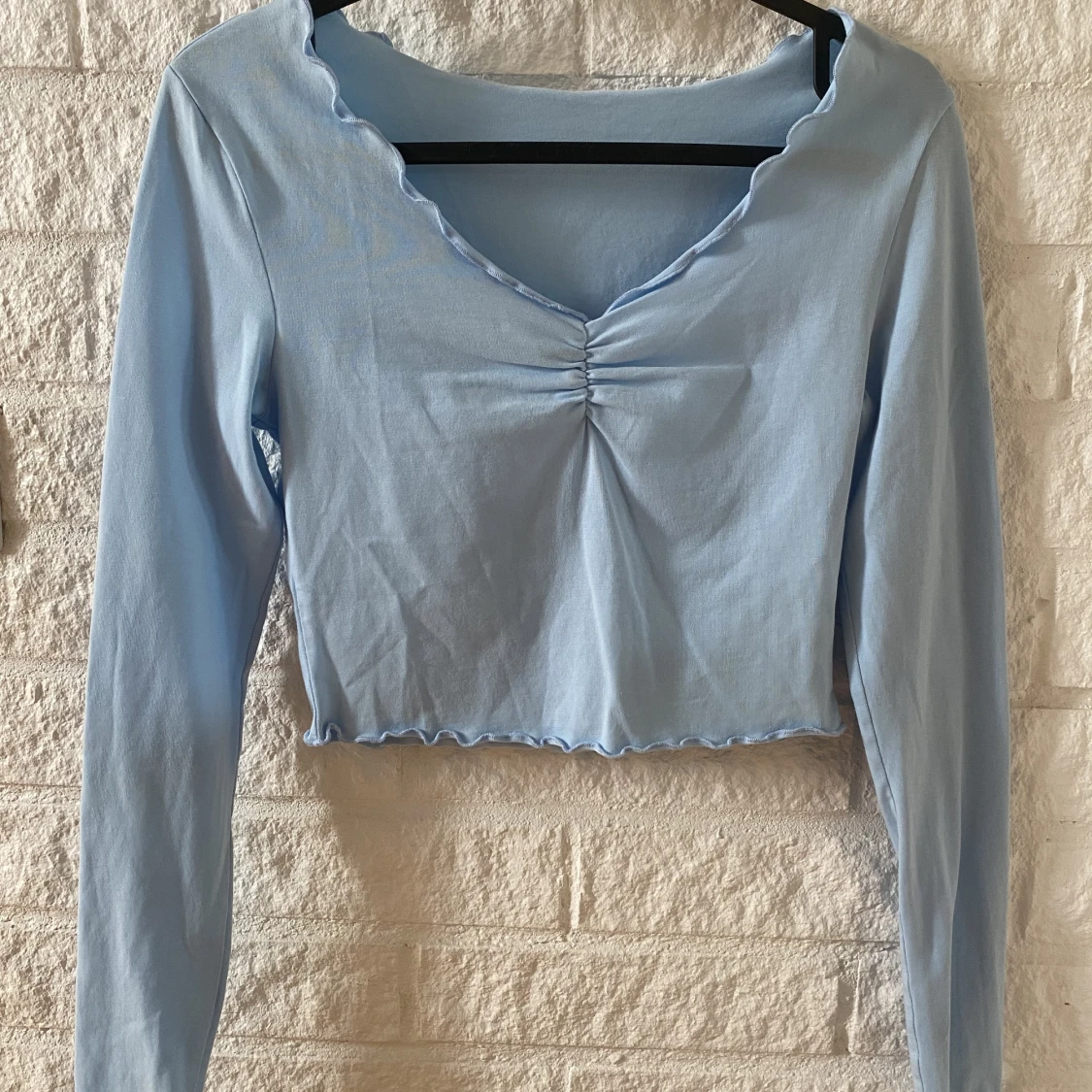 Ljusblå topp i storlek XS - 90