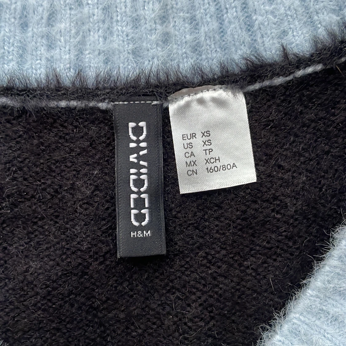 Pepitarutig ljusblå väst - 90