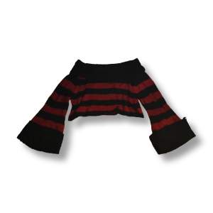 En cropped, långärmad, stickad tröja från Killstar. (Orginalpris: 549kr) säljs för den kommer inte till användning, använda väldigt fåtal gånger.