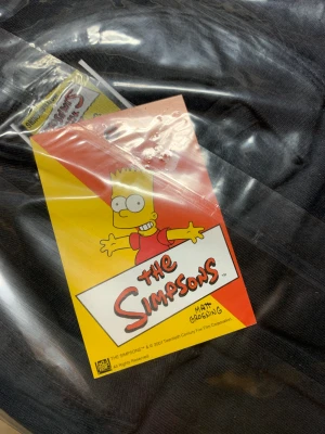 Vintage Deadstock Simpsons - Storlek Medium. Från 2001, i orginalförpackning med tag. Samlarobjekt?   Vintage, retro, Simpsons