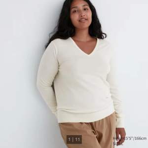 Very classy and elegant long sleeve sweater. Size M. Nice to wear on top of a shirt or by itself