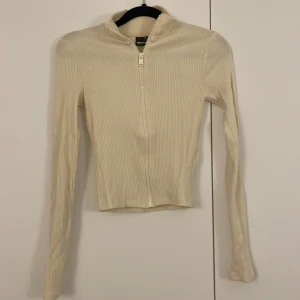 Tröja - Tröja med dragkedja i gul/vit färg