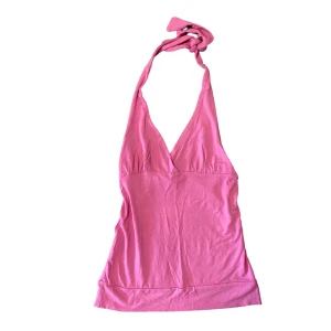 Rosa halterneck  - Står ingen storlek sitter som en S-M. Är stretchig. 