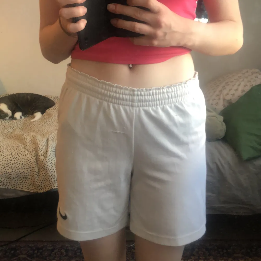 White Nike shorts, about 5 or 4 years old, hasn’t been worn much because I don’t think they fit me/my style.. Shorts.