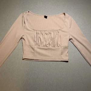 En rosa långärmad tröja  - Använt den en gång 