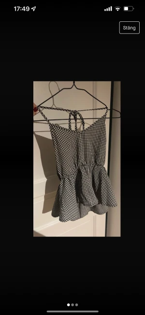 Topp - Kommer ej till användning. Rutig.