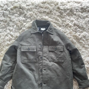 WEEKDAY OVERSHIRT  - Fits well and only used once. Looks good with Stockholm style and is a nice fit. 