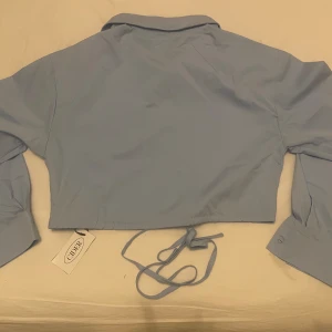 Blue top shirt - New with a tag!