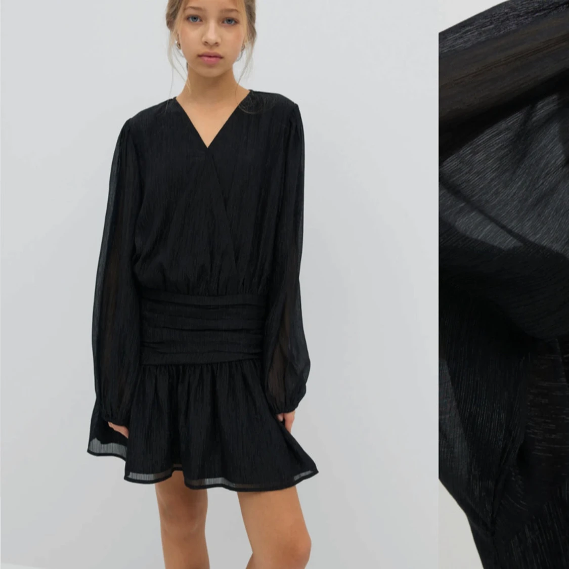 Svart/glittrig omlottklänning