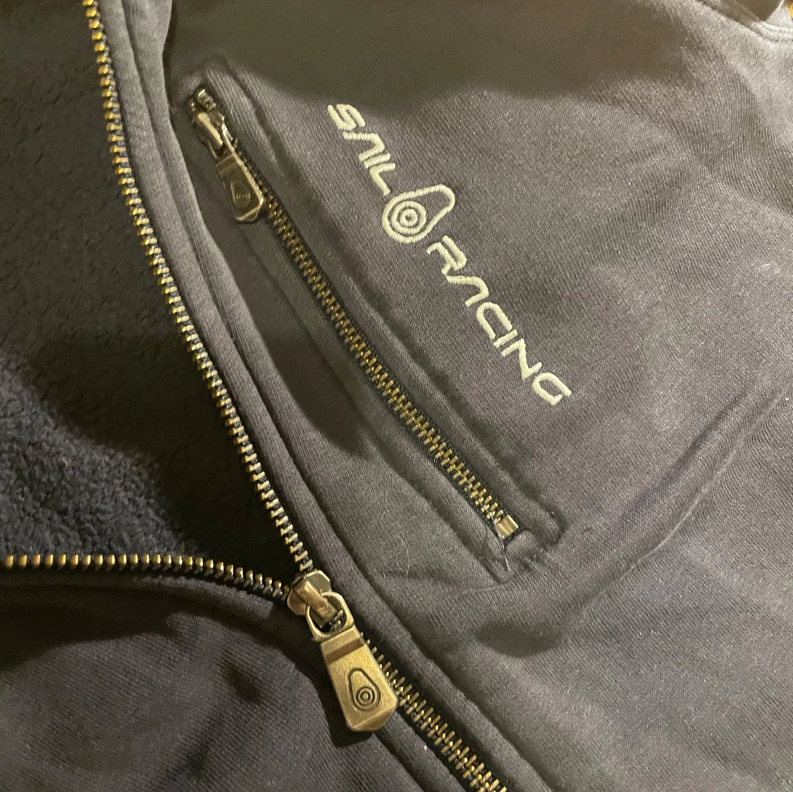 Mörkblå zip up från Sail Racing - 91