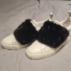 Nice Valentino sneakers is perfect condition. Mink detail. Comes with box.