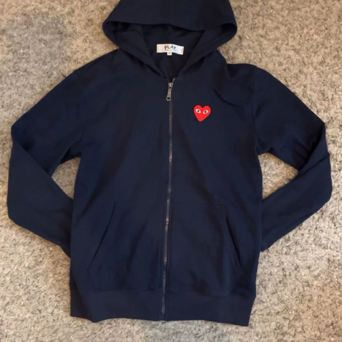 Svart hoodie från Comme des Garçons