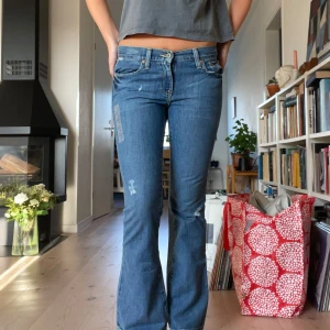 Lågmidjade jeans  - Bootcut jeans med revor