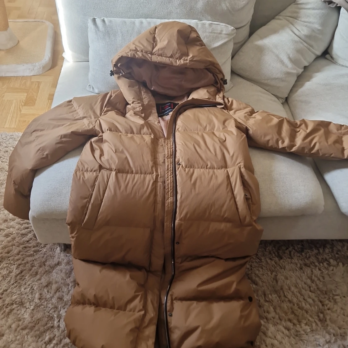 Brun lång dunjacka från Canada Snow