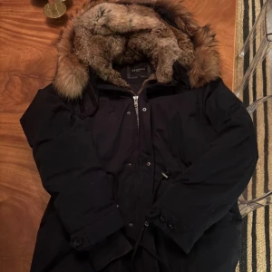Cedrico Jacket  - Cedrico jacket with fur hood. Navy blue with light colored fur. Worn but in good condition. 