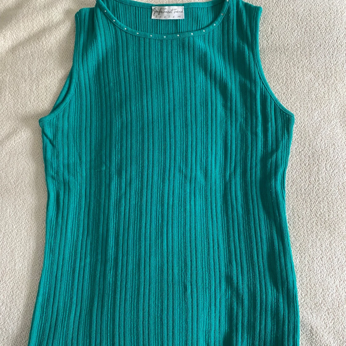 Turkos ribbad ärmlös topp