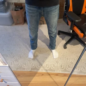 Blå tapered, stretch, Jack and Jones jeans - Blåa tapered, stretch, Jack and Jones jeans w30 L32