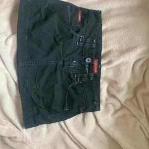 Minikjol  - Svart lågmidjad minikjol  Asball  Xs/xxs 