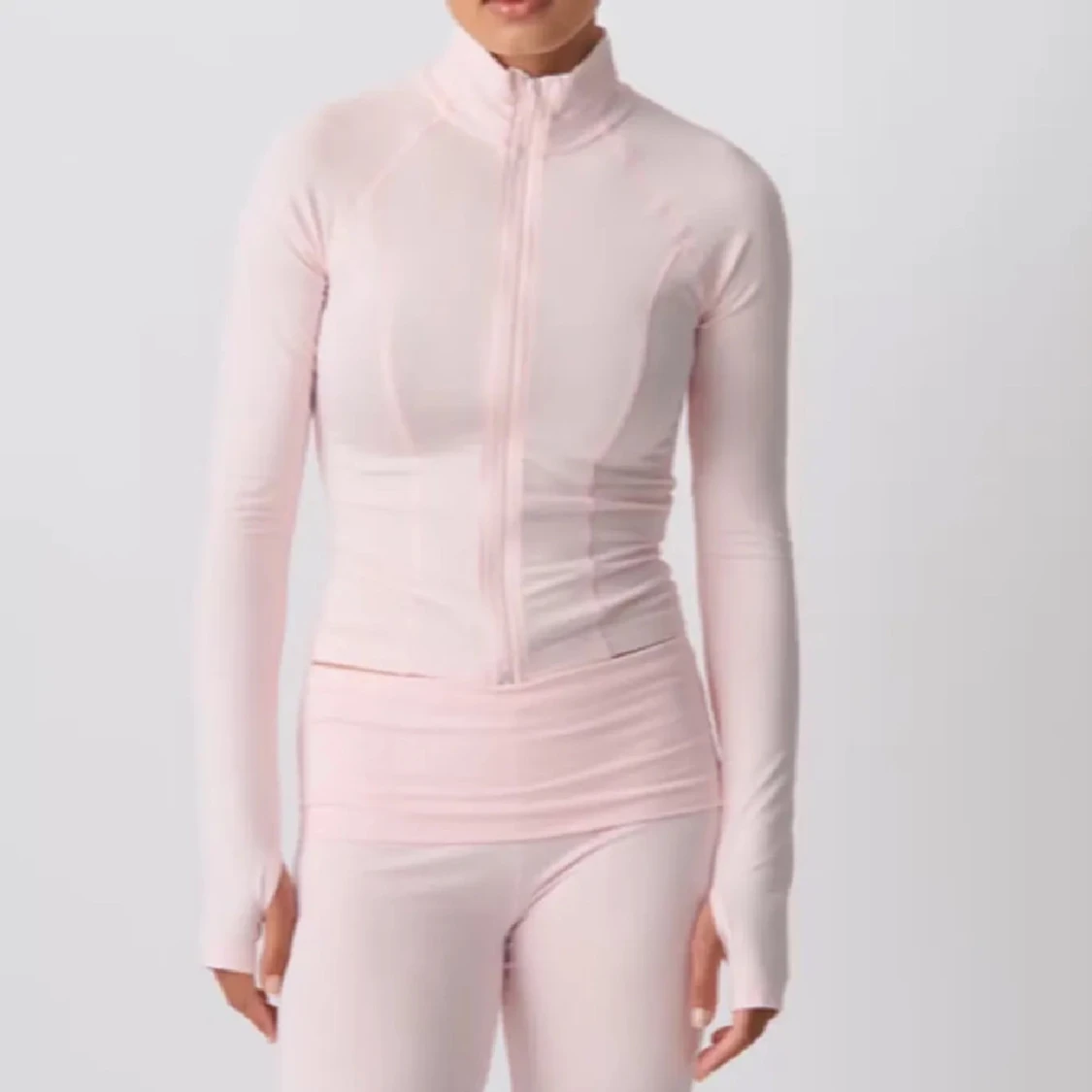 Ljusrosa träningströja från Gina Tricot