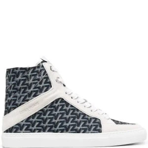 Svart och vit mönstrade sneakers med dragkedja - Säljer ett par  sneakers med blått och vit mönster från zadig. De har en snygg dragkedja på sidan och snörning framtill. Skorna är i välanvänt skick men fortfarande snygga men kan bejlva en tvätt. Perfekta för en avslappnad look!