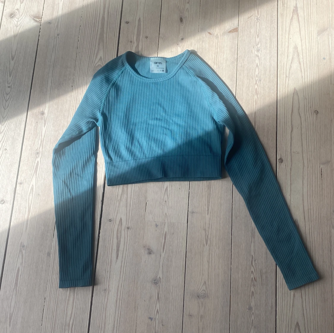 Mörkgrön träningströja från Aim’n