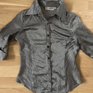 Striped fitted Blouse  - Incredibly cute and trendy blouse for night out or work. Fits more like S 