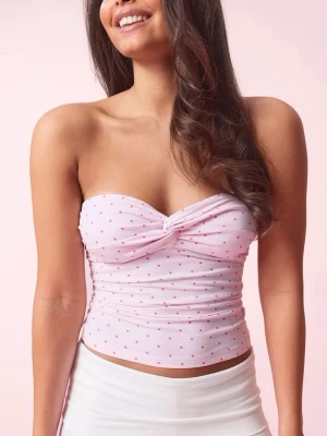 Ljusrosa prickig bandeau tubtopp - Super fin bandeau top ifrån Gina tricot, använd två ggr men är som ny. Säljer då den inte används, toppen är stretchig så passar även xs💗💗
