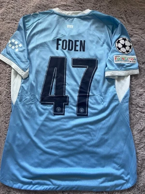 Manchester City 26/27 Phil Foden  - En Manchester City tröja 26/27 med Phil Foden spelar version, storlek L