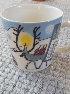 Muminmugg Vinterskog Mumin  - Felfri mugg med etikett kvar. Säljer fler Muminmuggar så kika gärna på mina övriga annonser också. Packar mycket noggrant. 